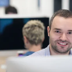 A man smiling at the camera