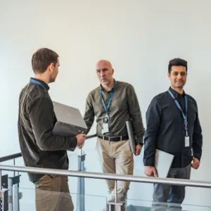 A group of people standing on a railing