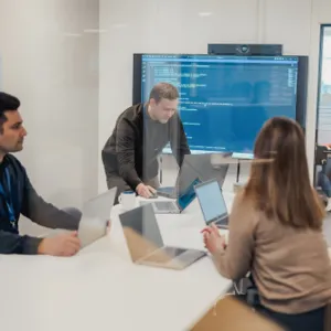 A group of people in a meeting