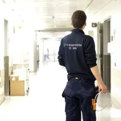 A man walking in a hallway